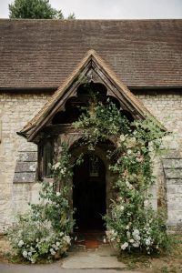 Wild asymmetric floral arch in Surrey