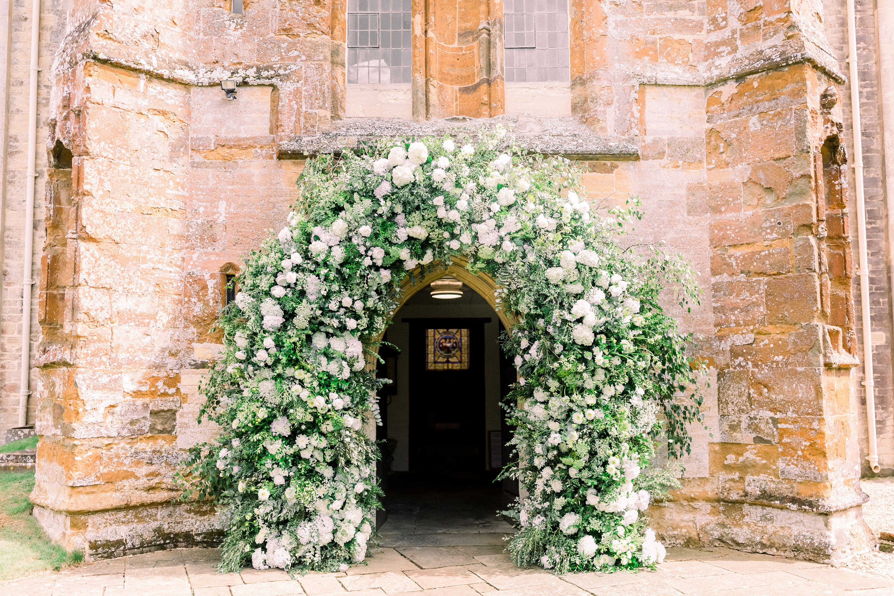 Statement floral arch at Aynhoe park Oxfordshire wedding venue